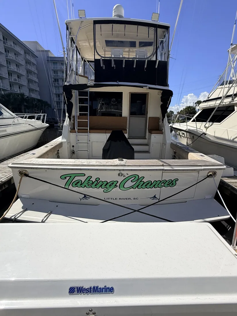 Boat with Taking Chances marine lettering